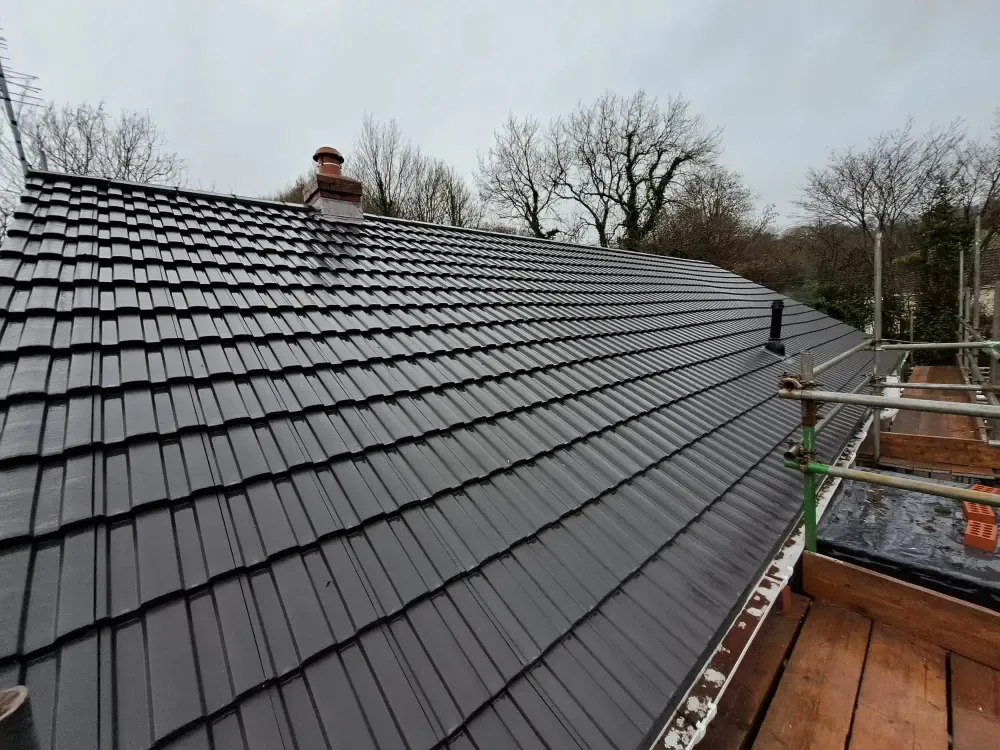 Newly completed tiled roof with the scaffold still in place