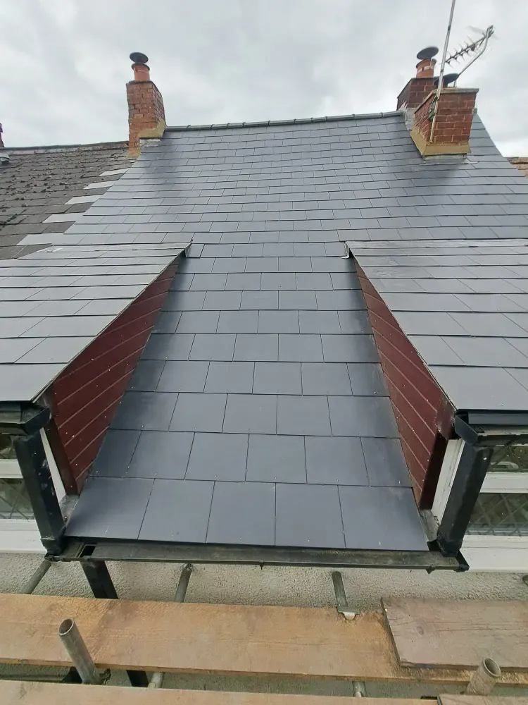 Re-slated roof with a flat-topped dormer set into the slope